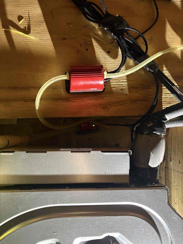 Removed and disposed of existing ductless heat pump system. Installed new Mitsubishi SUZ-AA12NL outdoor heat pump unit on existing wall bracket with surge disconnect. Mounted SLZ-AF12NL ceiling recessed fan coil with SLP-18FAU grille in attic space. Utilized existing refrigeration lines, condensation drain, and low voltage wiring to minimize invasive work. Flushed and pressure tested refrigeration lines to ensure system integrity, then recharged system to manufacturer specifications. Installed MHK2 wireless receiver and PAC-USWHS0002-WF-2 WiFi interface for remote control and monitoring capabilities. Connected condensate pump with proper drainage routing through attic joists. Verified all electrical connections, tested system operation across heating and cooling modes, and confirmed proper refrigerant pressures and temperatures using manifold gauges. System commissioned successfully with all components functioning within normal parameters.