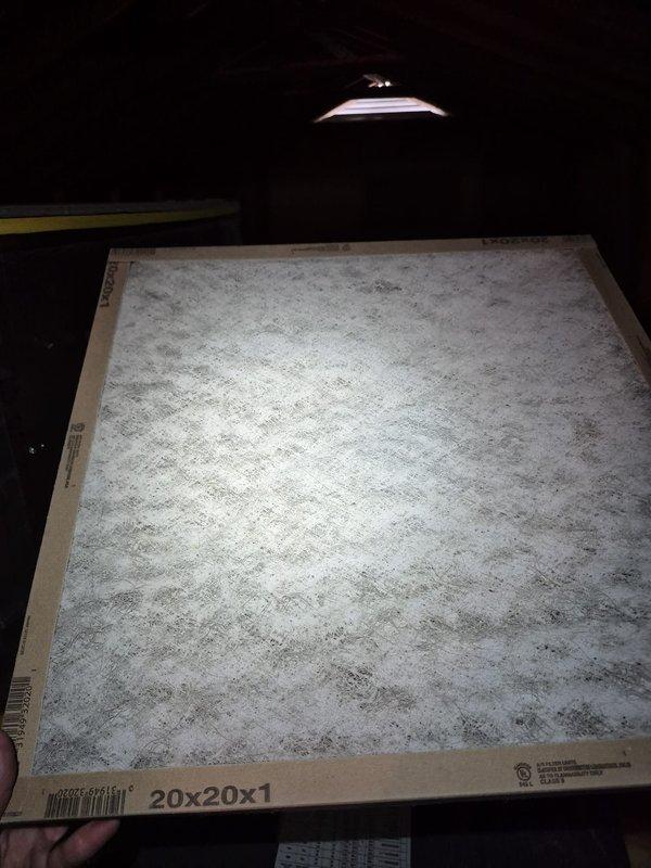 Responded to no cooling and humidity complaint on residential HVAC system. Found heavily soiled air filter restricting airflow, causing reduced cooling capacity and inadequate dehumidification. Replaced dirty filter with new filter media. Verified thermostat operation showing 77°F setpoint with system in cooling mode and fan set to auto. System restored to proper operation with improved airflow and cooling performance.