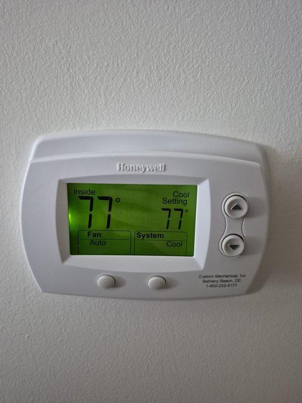 Responded to no cooling and humidity complaint on residential HVAC system. Found heavily soiled air filter restricting airflow, causing reduced cooling capacity and inadequate dehumidification. Replaced dirty filter with new filter media. Verified thermostat operation showing 77°F setpoint with system in cooling mode and fan set to auto. System restored to proper operation with improved airflow and cooling performance.