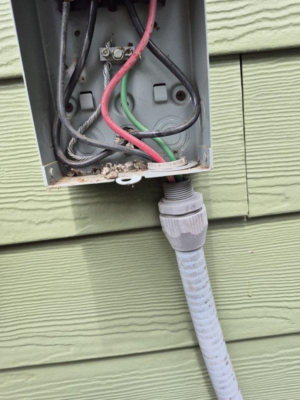Completed reinspection of HVAC system following previous service visit. Inspected outdoor disconnect box and electrical connections, verifying proper wire terminations and component functionality. Documented existing Turbo200 capacitor installation with all electrical connections secure and operational. System operating within normal parameters.