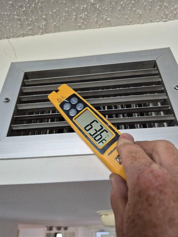 Responded to no cooling complaint on residential HVAC system. Performed diagnostic evaluation including temperature measurements at return air grille, which indicated supply air temperature of 63°F. Inspected mechanical thermostat operation and system response. Discussed findings with customer and provided repair estimate exceeding diagnostic fee threshold. Documented system conditions with photographs for service records.