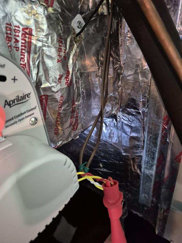 Responded to no cooling complaint on zoned HVAC system. Found tripped breaker which was reset by customer prior to arrival. Troubleshot zone control system and discovered first floor zone damper potentially stuck, preventing proper airflow distribution. Inspected zone control board displaying DAT sensor reading of 52°F and verified proper wiring connections to zone dampers and thermostat. Coordinated with Ecobee thermostat technical support to rule out thermostat programming issues. System operational at time of departure with all zones responding appropriately.