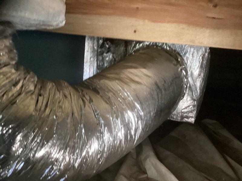 Responded to no cooling call for residential air conditioning system. Upon inspection, found outdoor condenser unit and crawlspace air handler system not operational. Evaluated existing equipment including outdoor condensing unit positioned on wooden platform with proper clearances and crawlspace-mounted air handler with flexible ductwork installation. Performed comprehensive system assessment and provided detailed replacement estimate for complete HVAC system upgrade to restore cooling functionality to the residence.