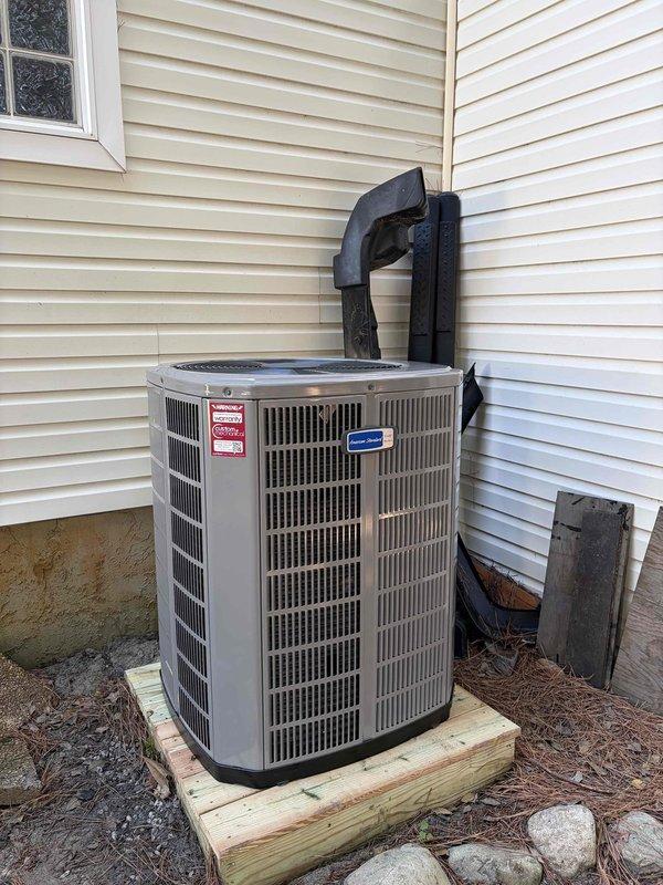 Completed full HVAC system replacement including removal and disposal of existing equipment. Installed 5A6H7036 3-ton 17 SEER heat pump outdoor unit on pressure-treated wood platform with proper electrical whip and disconnect. Installed 5TEM6D04 variable speed fan coil unit indoors with BAYHTT1715BRKR 15KW electric heater with integrated breaker. Flushed, pressure tested, and recharged refrigeration lines to manufacturer specifications. Installed 1-inch filter rack and THX1200W WiFi-enabled thermostat for system control. Verified all electrical connections, tested system operation across heating and cooling modes, and confirmed proper airflow and temperature differential. System commissioned successfully with one-year comprehensive warranty on all new equipment and installation.