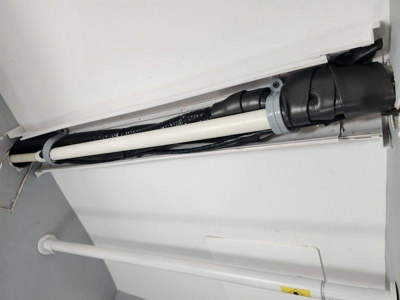 Removed existing mini split head unit and cut drywall behind wall bracket to inspect insulation and perform air sealing. Resecured drywall, installed new wall bracket to cover cutout, and mounted new MSZWX12NL wall hung air handler unit with refrigerant lines and electrical connections completed per manufacturer specifications.