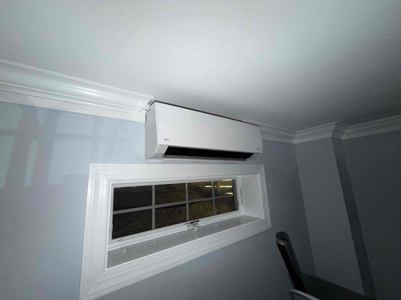 Responded to no cooling call on ductless mini-split system serving downstairs living room. Upon arrival, found outdoor condensing unit not operating. Diagnosed failed outdoor fan motor on Fujitsu mini-split condenser unit. System inoperable until motor replacement can be completed.