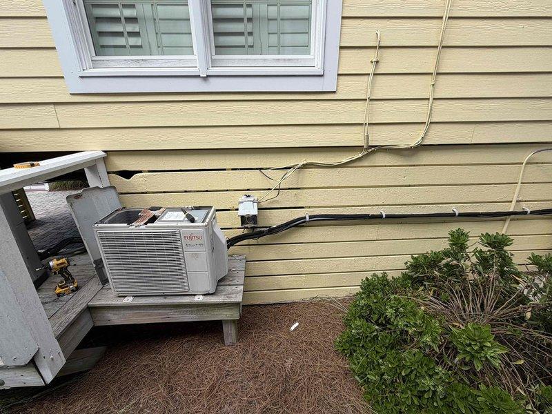 Responded to no cooling call on ductless mini-split system serving downstairs living room. Upon arrival, found outdoor condensing unit not operating. Diagnosed failed outdoor fan motor on Fujitsu mini-split condenser unit. System inoperable until motor replacement can be completed.