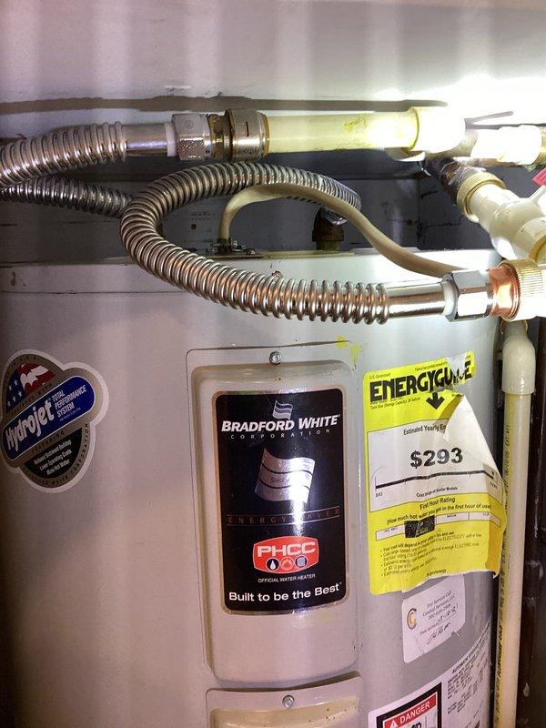 Completed comprehensive appliance and plumbing installation at residential property. Installed new kitchen sink drain assembly, faucet, garbage disposal, and dishwasher with all connections properly secured and tested for leaks. Reset existing Bradford White water heater, verifying proper operation of temperature and pressure relief valve, supply lines, and all connections. Installed washer and dryer with appropriate water supply lines and drain connections. Coordinated with electrical contractor for installation of dedicated outlet under sink base to power garbage disposal and dishwasher. Installed WiFi-enabled water alarm sensors at strategic locations for leak detection and monitoring. All fixtures tested and confirmed operational upon completion.