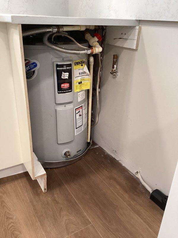 Completed comprehensive appliance and plumbing installation at residential property. Installed new kitchen sink drain assembly, faucet, garbage disposal, and dishwasher with all connections properly secured and tested for leaks. Reset existing Bradford White water heater, verifying proper operation of temperature and pressure relief valve, supply lines, and all connections. Installed washer and dryer with appropriate water supply lines and drain connections. Coordinated with electrical contractor for installation of dedicated outlet under sink base to power garbage disposal and dishwasher. Installed WiFi-enabled water alarm sensors at strategic locations for leak detection and monitoring. All fixtures tested and confirmed operational upon completion.