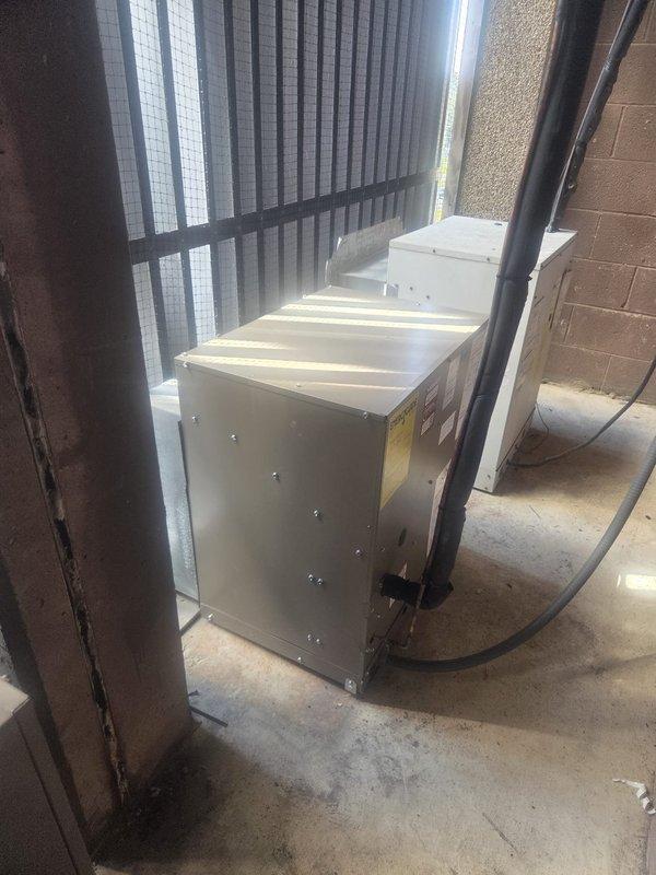 Completed full HVAC system replacement for new customer including removal and disposal of existing equipment. Installed 2-ton NCP524 outdoor air conditioning unit on concrete pad in exterior closet with proper disconnect and electrical whip. Furnished and installed CBK45UHVT-024 variable speed fan coil unit in mechanical room with ECB45-10BK 10KW electric heater with breaker. Flushed, pressure tested, and recharged refrigeration lines to manufacturer specifications. Installed condensate safety float switch on drain line for overflow protection. Completed electrical connections including all required disconnects and circuit protection. Programmed and configured THX1200W WiFi thermostat for system operation. Verified all components operating correctly with proper airflow, refrigerant charge, and temperature differential. System commissioned and left in full operational condition with one-year parts warranty coverage.