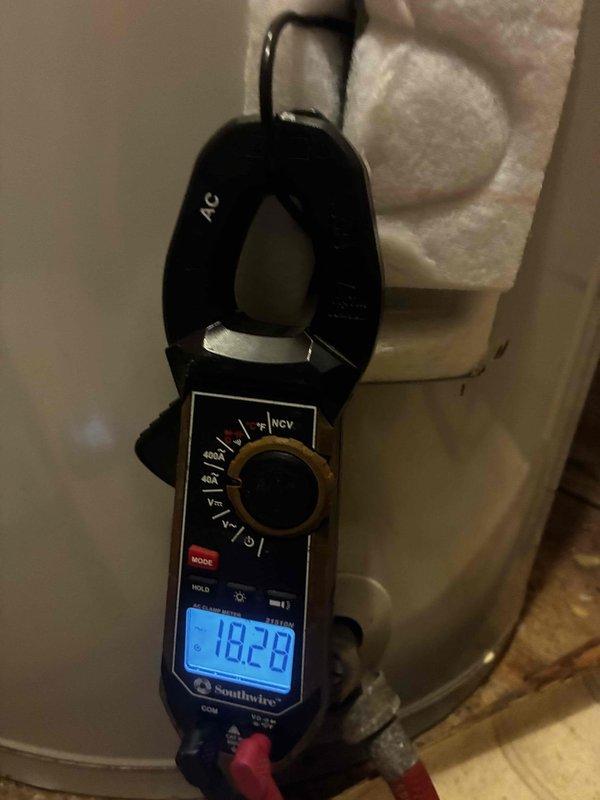 Responded to no hot water complaint on A.O. Smith tanked water heater. Upon arrival, performed electrical diagnostics using clamp meter to measure current draw on heating element circuit, obtaining reading of 18.28 amps. Inspected water heater installation including copper supply lines, temperature and pressure relief valve connections, and proper venting. Verified unit specifications and reviewed energy guide information. Diagnosed heating element failure preventing water from reaching set temperature. Documented equipment condition and measurements for repair recommendation.