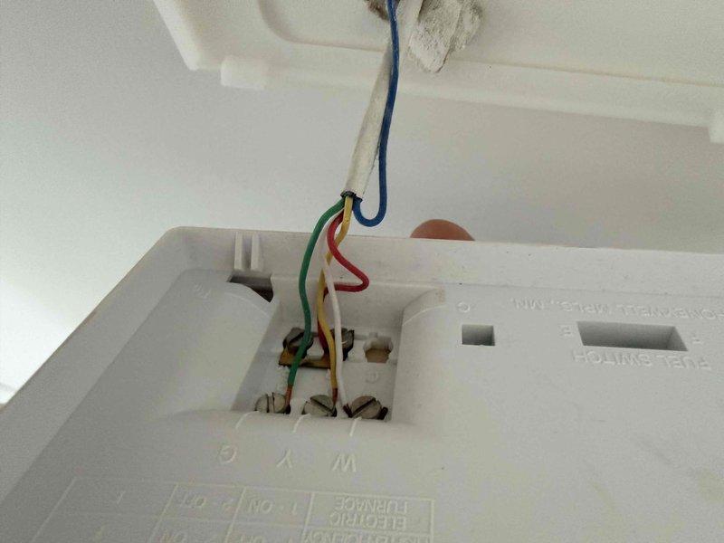 Conducted site assessment for upstairs HVAC system replacement located in attic space with pull-down access. Evaluated existing gray metal air handler unit, electrical connections, condensate drain lines, and ductwork configuration. Documented current system condition including wiring terminations, PVC drainage piping, and equipment placement on wooden support structure. Downstairs system verified as operational and not requiring replacement at this time. Customer planning installation for late September or October timeframe.