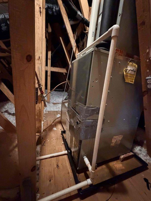Conducted site assessment for upstairs HVAC system replacement located in attic space with pull-down access. Evaluated existing gray metal air handler unit, electrical connections, condensate drain lines, and ductwork configuration. Documented current system condition including wiring terminations, PVC drainage piping, and equipment placement on wooden support structure. Downstairs system verified as operational and not requiring replacement at this time. Customer planning installation for late September or October timeframe.
