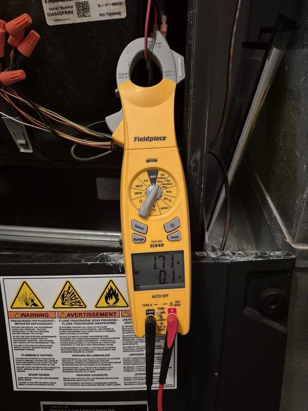Performed routine cooling system maintenance and diagnostics on residential HVAC unit. Utilized Fieldpiece SC640 multimeter to verify electrical parameters and measure voltage readings at control board terminals. All electrical connections inspected and confirmed secure, with proper wire terminations observed throughout the system. Unit operational and functioning within normal parameters at time of service completion.