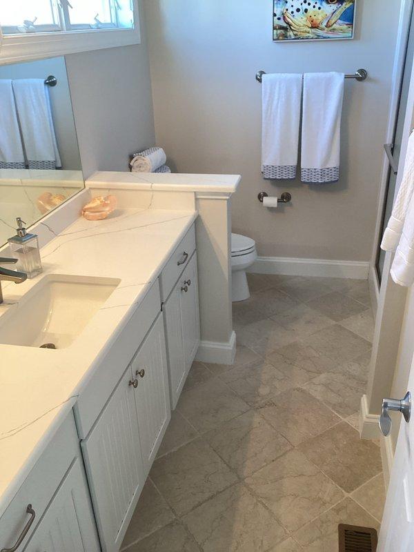 Responded to service call for plumbing issue under code 2501. Upon arrival, conducted thorough inspection of bathroom plumbing systems and fixtures. All visible plumbing connections, supply lines, and drain assemblies were examined for signs of leaks, water damage, or burst pipe conditions. Documented existing conditions of bathroom showing double vanity with undermount sinks, toilet, shower enclosure, and surrounding areas. No active leaks or water damage observed on flooring, walls, or ceiling during inspection. All fixtures and connections found to be functioning properly with no evidence of recent pipe failure or water intrusion.