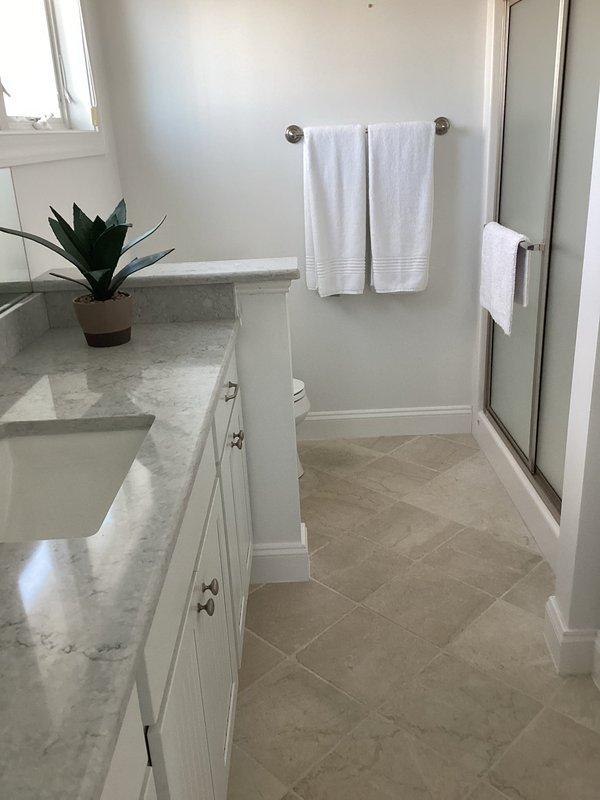 Responded to service call for plumbing issue under code 2501. Upon arrival, conducted thorough inspection of bathroom plumbing systems and fixtures. All visible plumbing connections, supply lines, and drain assemblies were examined for signs of leaks, water damage, or burst pipe conditions. Documented existing conditions of bathroom showing double vanity with undermount sinks, toilet, shower enclosure, and surrounding areas. No active leaks or water damage observed on flooring, walls, or ceiling during inspection. All fixtures and connections found to be functioning properly with no evidence of recent pipe failure or water intrusion.