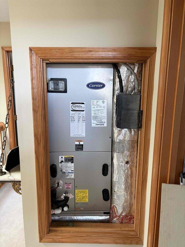 Completed routine cooling maintenance visit on two HVAC systems. Performed comprehensive inspection of Carrier air handler unit installed in recessed wall cavity, verified proper operation of all components, checked refrigerant lines and ductwork connections for secure installation and proper insulation. All systems operating within normal parameters with no issues identified during inspection.