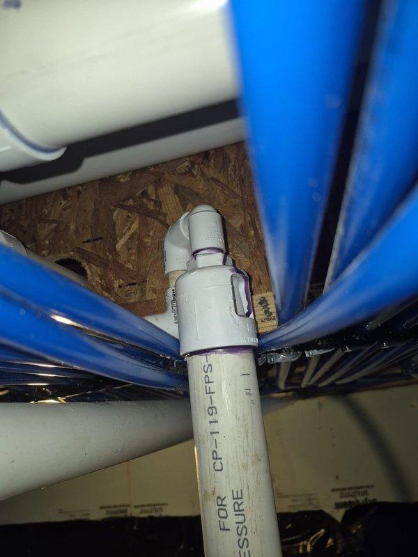 Responded to customer report of dripping sound inside PVC pipe under house. Performed comprehensive inspection of crawl space plumbing system, examining all visible PVC drain lines, P-trap assemblies, and pressure pipe connections. Inspected pipe joints, fittings, and primer applications for signs of moisture, active leaks, or structural defects. Documented existing plumbing configuration including vertical pressure lines and drain assemblies with photographic evidence. No active water leakage or floor damage observed during inspection. All accessible pipe connections, clamps, and support systems found secure and properly installed.