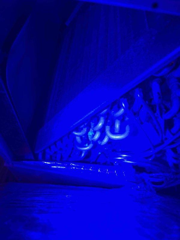 Performed routine cooling maintenance visit on residential HVAC system. Inspected evaporator coil assembly using UV lighting, confirming clean condition with no debris accumulation or biological growth. Addressed condensation line leak issue at patio discharge point, cleared blockage, and verified proper drainage flow from air handler to exterior termination point, resolving HOA-reported water discharge concern.