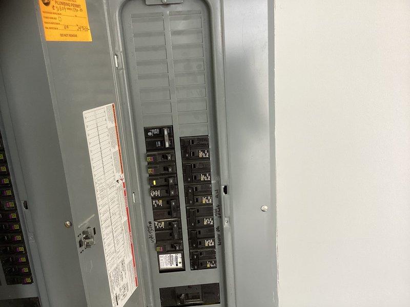 Conducted on-site evaluation for mini split installation in two separate garage spaces and assessed potential dehumidification needs. Inspected existing electrical panel to verify capacity and available circuits for new equipment installation, documented electrical infrastructure and interior wall space for indoor unit placement.