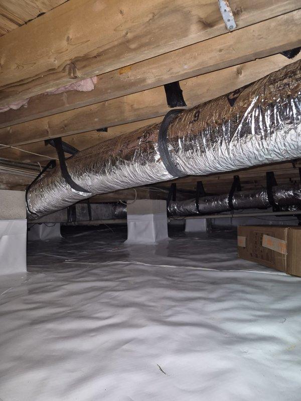 Replaced water-damaged 6" flexible ductwork in crawlspace located beneath the rear sliding glass door. Removed compromised flex line and installed new insulated flexible duct, properly secured with fabric straps to floor joists. Verified proper airflow and system operation upon completion.