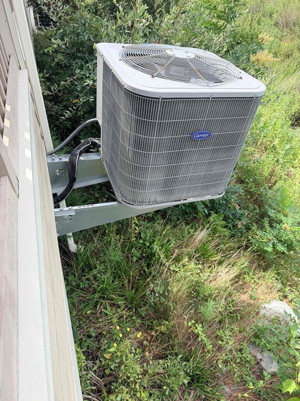Conducted on-site assessment of existing 15-year-old Carrier HVAC system currently mounted on exterior metal platform bracket. Provided comprehensive estimate for complete system replacement due to age and operational efficiency concerns. Additionally prepared separate estimate for system relocation to comply with homeowner association requirements mandating repositioning of outdoor condensing unit. Documented current installation configuration including electrical conduit routing, mounting hardware, and existing placement adjacent to building exterior wall. Evaluated structural considerations for potential relocation including access requirements, electrical service modifications, and refrigerant line routing options.