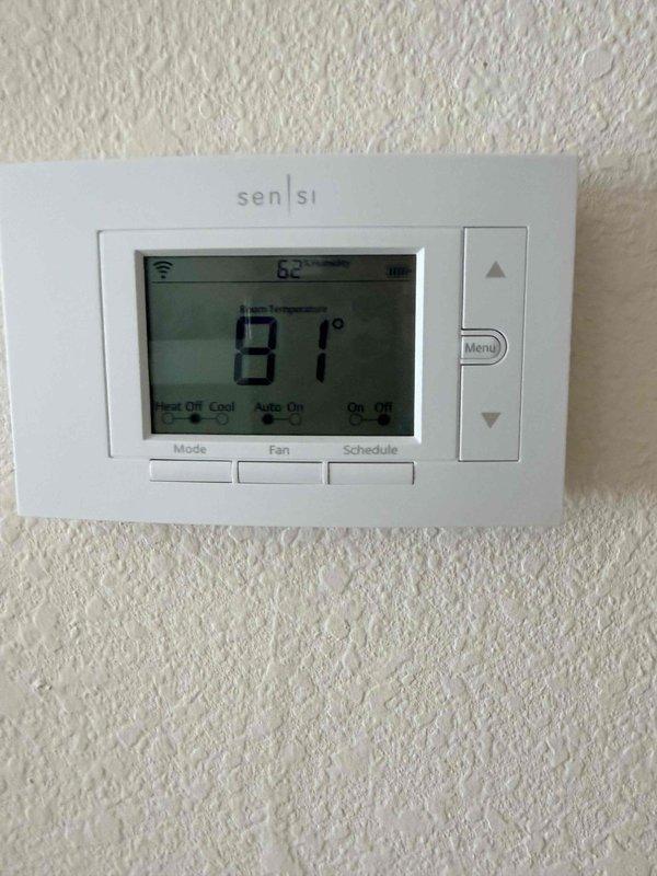 Responded to service call for HVAC system not maintaining temperature at property listed for sale. Upon inspection, found 22-year-old system was out of refrigerant, indicating likely refrigerant leak. Assessed attic-installed air handler and ductwork, documented existing equipment condition with photos, and provided comprehensive replacement estimate for new HVAC system due to age and refrigerant loss making repair economically unfeasible.