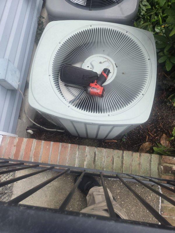 # HVAC Maintenance Service Completed

Performed comprehensive heating and cooling system maintenance on residential split HVAC system. Inspected indoor air handler unit located in utility closet alongside water heater, verifying proper operation of all components and connections. Examined refrigerant lines, electrical connections, and ductwork for signs of wear or damage. All indoor unit labels and safety information confirmed visible and legible.

Proceeded to outdoor condenser unit for external inspection and maintenance procedures. Accessed light green condenser unit positioned on concrete pad with brick border edging. Evaluated fan grille assembly, condenser coil condition, and overall unit operation. Verified proper clearances around equipment and checked for debris accumulation. Completed routine maintenance tasks on cooling system components as part of recurring service agreement. Both heating and cooling systems inspected and confirmed operational.