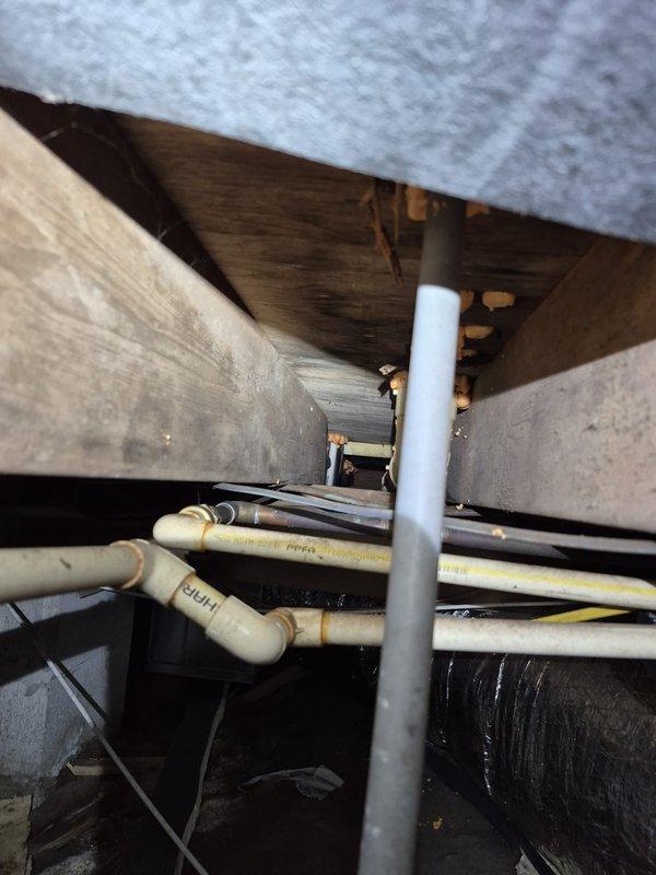 Responded to cooling complaint with indoor humidity reading at 75%. Performed comprehensive diagnostic evaluation of ductwork system and airflow performance. Conducted thorough inspection of crawl space and attic areas, examining all accessible ductwork runs, connections, and structural penetrations. 

Visual inspection revealed metallic supply ducts in attic space with reflective insulation wrap. Assessed duct sealing integrity at joints, connections, and boot terminations. Examined crawl space plumbing penetrations and floor joist areas for potential air infiltration paths affecting system performance. Documented existing ductwork configuration, insulation conditions, and potential leakage points throughout distribution system.

Evaluated overall system airflow characteristics and identified opportunities for duct sealing improvements to address humidity concerns. Provided customer information regarding Energize Delaware home energy assessment program for comprehensive leakage identi