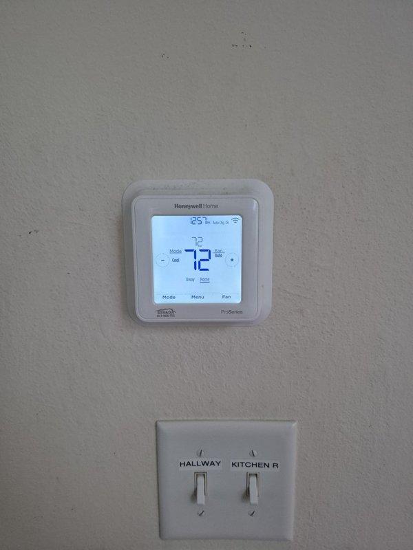 Completed recurring heating maintenance visit on two HVAC systems. Performed comprehensive system diagnostics using digital multimeter to verify electrical parameters and operational status. Verified thermostat functionality showing proper temperature control at 72 degrees in auto mode, confirmed accurate communication between control system and heating equipment, and documented all system components operating within normal specifications.