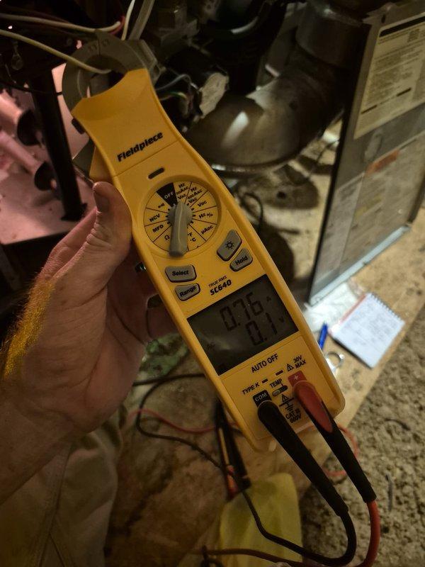 Completed recurring heating maintenance visit on two HVAC systems. Performed comprehensive system diagnostics using digital multimeter to verify electrical parameters and operational status. Verified thermostat functionality showing proper temperature control at 72 degrees in auto mode, confirmed accurate communication between control system and heating equipment, and documented all system components operating within normal specifications.