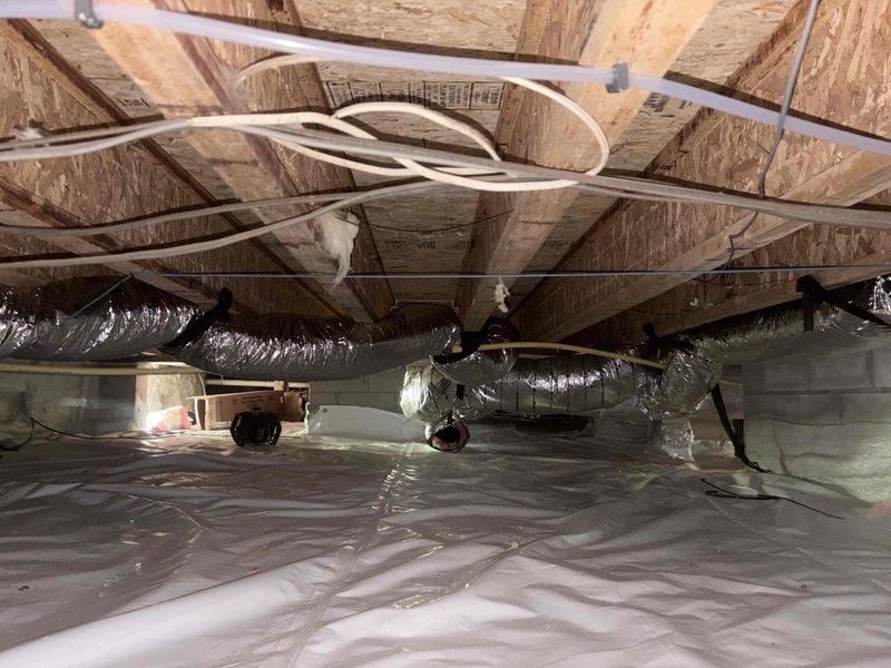 Removed all existing supply flex duct runs from the crawlspace and installed new flexible ductwork, routing each run back to its original location to maintain proper airflow distribution throughout the system. All new duct connections were properly sealed using mastic (hard cast) to ensure airtight joints and prevent conditioned air loss. The installation includes properly supported and insulated flex duct runs secured to the structural framework, with vapor barrier protection maintained at floor level.
