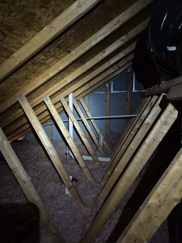 Replaced a damaged section of 3" PVC vent pipe in the attic using 6 feet of new pipe, one 90-degree elbow, and two couplings to restore proper drainage function. Installed a new condensate drain line consisting of 30 feet of 3/8" poly tubing connected via a barbed fitting to 3/4" male adapter, transitioning to 30 feet of 3/4" PVC pipe that was routed from the attic, down through the soffit, and terminated into the gutter system. Secured all piping with six 3/4" pipe clamps to ensure proper support and prevent future sagging or disconnection.