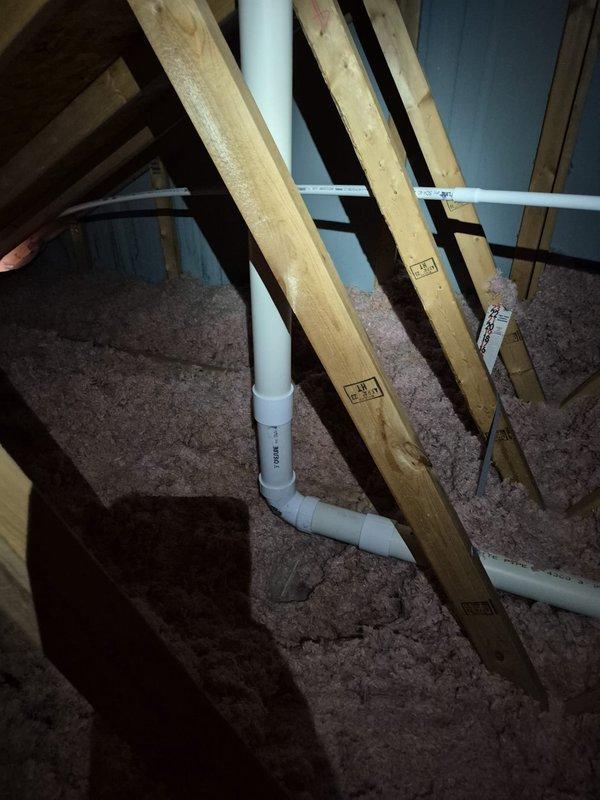 Replaced a damaged section of 3" PVC vent pipe in the attic using 6 feet of new pipe, one 90-degree elbow, and two couplings to restore proper drainage function. Installed a new condensate drain line consisting of 30 feet of 3/8" poly tubing connected via a barbed fitting to 3/4" male adapter, transitioning to 30 feet of 3/4" PVC pipe that was routed from the attic, down through the soffit, and terminated into the gutter system. Secured all piping with six 3/4" pipe clamps to ensure proper support and prevent future sagging or disconnection.