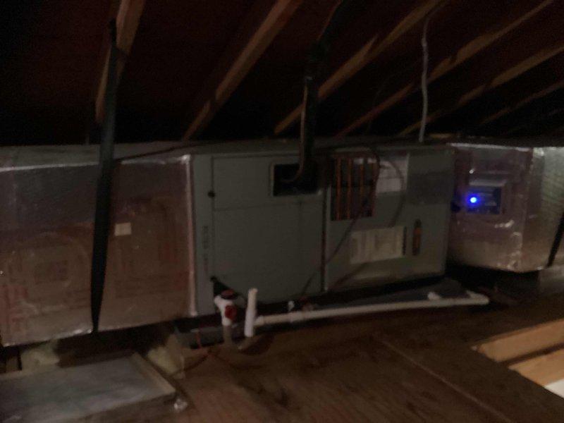 Completed HVAC estimate for multi-unit system replacement in residential attic space. Assessed existing equipment configuration, attic access conditions, and installation requirements for proposed air handler units with associated ductwork and condensate drainage systems. Documented current attic structural layout, clearances, and accessibility through ceiling-mounted access hatch to determine feasibility and scope of replacement work.