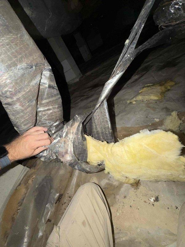 Responded to no cooling complaint and investigated crawlspace after customer reported hearing a crash under bathroom area. Located disconnected flexible ductwork in crawlspace that had separated from the system, causing complete loss of conditioned air to affected zones. Reconnected and secured the ductwork section, verified all connections were properly sealed, and restored airflow throughout the system. System tested and confirmed operating normally with proper cooling restored to all areas.