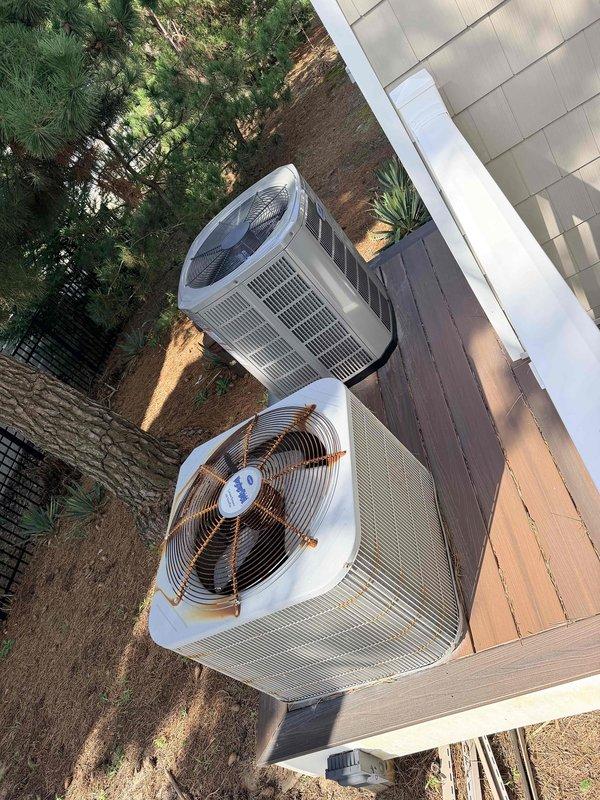 Conducted on-site evaluation for HVAC system replacement at residential condo unit. Assessed existing Bryant indoor air handler installed in interior wall cavity with exposed framing and documented current equipment specifications. Evaluated outdoor condensing units positioned on exterior grade, noting two units present at property. Provided estimate for replacement system comparable to neighboring unit's installation, recommending 2.5-ton 14 SEER heat pump system to match identical condo layout and heating/cooling requirements.