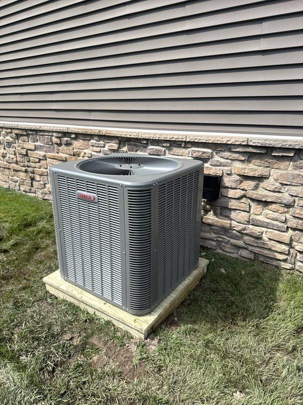Completed full HVAC system replacement at residential property. Removed and disposed of existing heating and cooling equipment. Installed new Lennox ML180UH090V48BK 80% gas furnace with variable speed blower in interior utility room. Mounted Lennox CK40CT-48B evaporator coil to furnace. Fabricated and installed metal duct transitions to adapt new equipment to existing ductwork. Reused existing condensate drain lines where applicable. Installed Lennox LP conversion kit for proper gas operation.

Positioned new Lennox ML14KC1-042 3.5-ton 14 SEER air conditioner on pressure-treated wood platform at exterior location. Replaced outdoor electrical disconnect and supply whip to meet current code requirements. Reused existing refrigerant line set and electrical power supply from previous installation. Completed all refrigerant connections between outdoor condensing unit and indoor evaporator coil. Evacuated system, pressure tested, and charged with proper refrigerant per manufacturer specifica