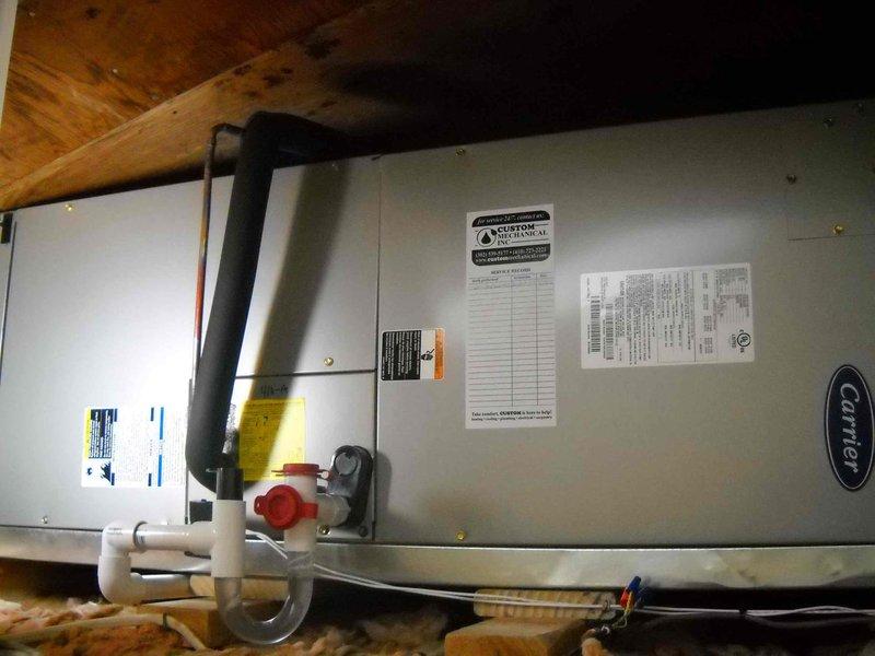 Conducted site assessment for complete HVAC system replacement at residential property. Evaluated existing 15-year-old main house air conditioning system with Carrier air handler located in attic space and outdoor condenser units mounted on wooden platforms, as well as aging ductless mini-split system. Documented current equipment configuration including refrigerant lines, electrical connections, condensate drainage, and outdoor unit placement. Photographed all equipment for replacement quote preparation, specifically focusing on conversion from straight cooling system to heat pump configuration for main house system. Provided homeowner with comprehensive evaluation for dual system replacement to improve efficiency and heating capabilities.