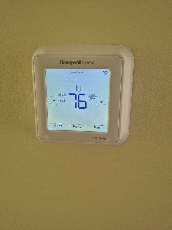 Completed scheduled heating maintenance on HVAC system. Performed comprehensive inspection of unit components, electrical connections, and safety systems. Verified thermostat operation showing proper communication with heating equipment, with display functioning correctly and WiFi connectivity active. All safety labels and warnings clearly visible on equipment panels. System operating within normal parameters upon completion, and owner notified as requested.