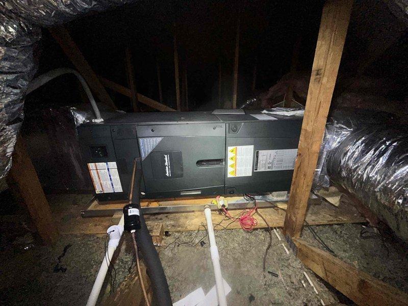Responded to service call for ductwork replacement in attic space. Inspected existing HVAC air handler unit and assessed current ductwork configuration including flexible metallic ducts. Created detailed schematic diagram documenting complete ductwork layout with measurements: central air handler (20"H x 28"W), branch runs measuring 95", 140", 30", 18", and 15", various duct transitions sized at 10x8, 10x10, 10x3, and 8x8. Documented requirements for (6) 5-inch flex ducts and (3) 6-inch flex ducts. Photographed attic installation showing air handler positioned on wooden platform between joists with existing silver flexible ductwork on both sides, PVC condensate drain line, and electrical connections. Provided pricing information and communicated with facility contact for approval to proceed with ductwork replacement.