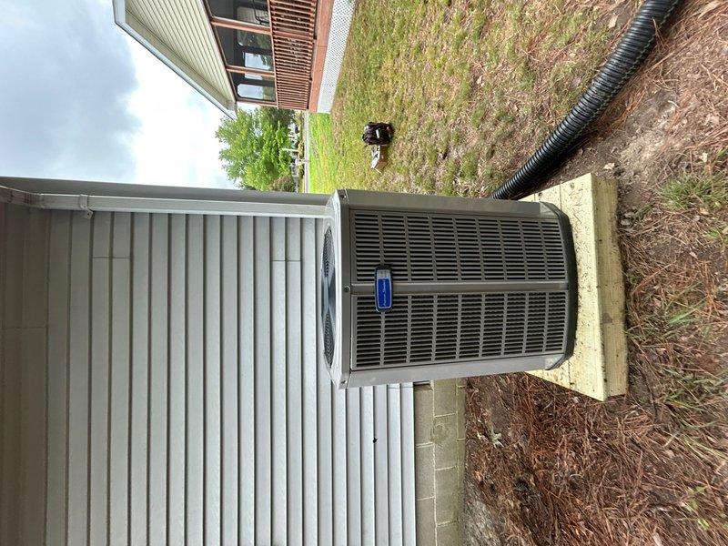 Completed full HVAC system replacement including removal and disposal of existing equipment. Installed 5A6H7024 2-ton 17 SEER heat pump on outdoor platform with surge disconnect and whip. Installed 5TEM6B02 variable speed fan coil unit in attic with drain pan and shut-off valve. Integrated BAYHTR1510BRKR 10KW electric heater with breaker into air handler. Flushed, pressure tested, and recharged refrigeration lines to manufacturer specifications. Installed THX1200W WiFi thermostat for system control. Verified all electrical connections, tested system operation across all modes, and confirmed proper airflow and temperature differentials. System operational with one-year parts and labor warranty on new equipment.