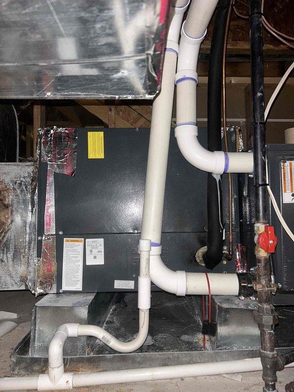 Responded to third callback for no cooling condition on system less than 10 years old. Upon arrival, performed comprehensive diagnostic evaluation of both outdoor condensing unit and indoor air handler. Inspected condenser operation, verified proper electrical connections at outdoor disconnect and control board, and checked refrigerant pressures. Examined indoor air handler for airflow restrictions, filter condition, and proper blower motor operation. Documented equipment condition with photos showing exterior condenser installation with associated piping and electrical connections, as well as attic-mounted air handler with visible ductwork and refrigerant lines. Determined root cause of cooling failure and provided customer with repair options and associated costs for resolution, as this represented a new issue separate from previous service visits.
