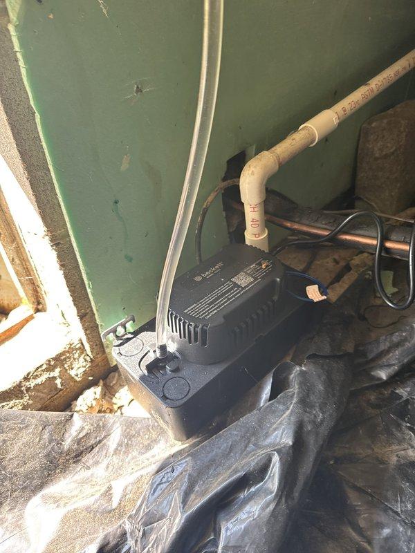 Removed and disposed of existing second floor HVAC system. Installed 2-ton 17 SEER heat pump outdoor unit on platform with surge disconnect and whip, paired with variable speed fan coil unit set in drain pan with shutoff valve. Flushed, pressure tested, and recharged refrigeration lines to manufacturer specifications. Installed 10KW backup heater with breaker and WiFi thermostat for complete system control and monitoring.