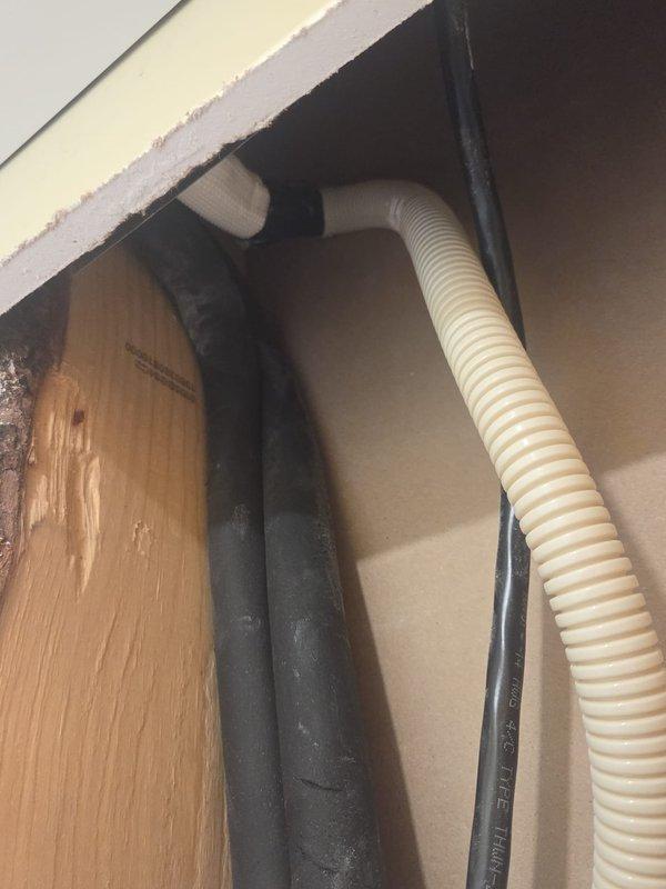 Returned to property after drywall in laundry room was removed to access mini split drain line. Located and corrected kink in drain line that was preventing proper drainage. Installed approximately 25 feet of new mini split drain line to ensure proper condensate removal and system operation.