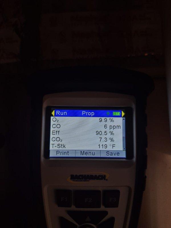 Performed comprehensive heating system maintenance and combustion analysis on HVAC unit. Conducted efficiency testing using Bacharach combustion analyzer, recording optimal performance parameters: oxygen level at 9.9%, carbon monoxide at 6 ppm (well within safe limits), system efficiency at 90.5%, carbon dioxide at 7.3%, and stack temperature at 119°F. Verified Honeywell thermostat operation and calibration, confirming proper temperature display and control functions. All system components operating within manufacturer specifications with no deficiencies noted.