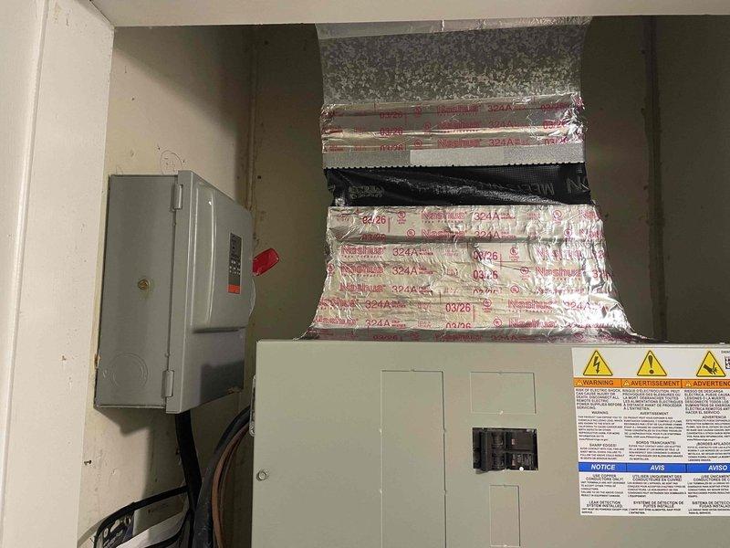 Responded to service call for indoor unit installed in February with loose ductwork connections. Upon inspection, found deteriorated foil tape and insulation peeling from flexible ductwork at multiple connection points in mechanical room and attic space. Resecured all loose duct connections, replaced failing tape with proper mastic sealant and foil tape, and verified proper airflow throughout system to restore indoor air quality and system efficiency.