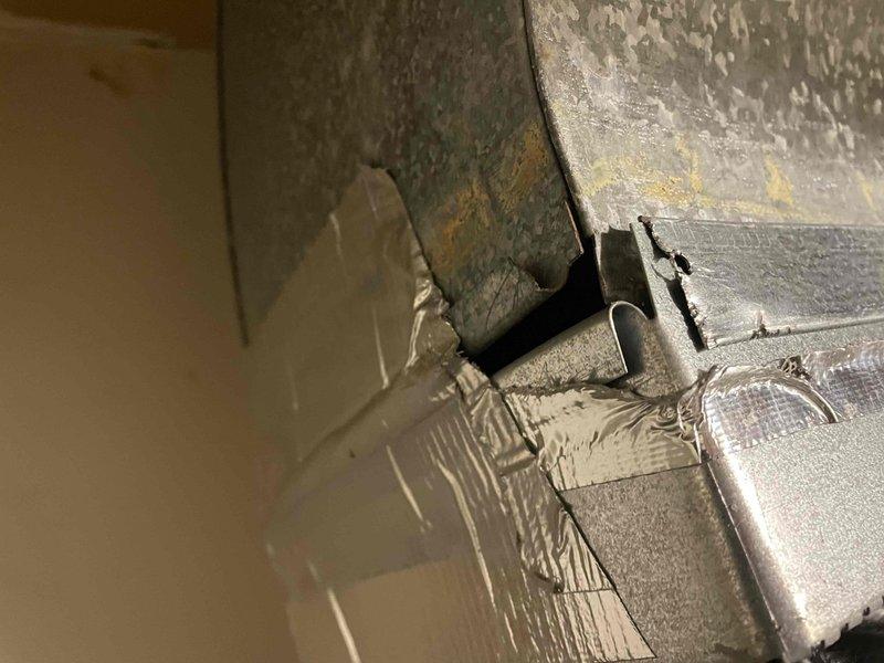 Responded to service call for indoor unit installed in February with loose ductwork connections. Upon inspection, found deteriorated foil tape and insulation peeling from flexible ductwork at multiple connection points in mechanical room and attic space. Resecured all loose duct connections, replaced failing tape with proper mastic sealant and foil tape, and verified proper airflow throughout system to restore indoor air quality and system efficiency.
