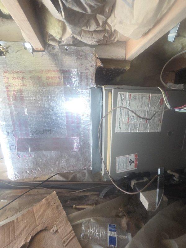 Conducted comprehensive ductwork assessment in attic space to evaluate existing system condition and determine replacement requirements. Inspection revealed fiberglass ductboard and damaged flexible duct runs requiring elimination and replacement. Documented system configuration including furnace connections, flex duct routing, and insulation conditions with photographic evidence for estimate preparation.