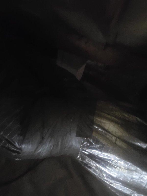 Conducted comprehensive ductwork assessment in attic space to evaluate existing system condition and determine replacement requirements. Inspection revealed fiberglass ductboard and damaged flexible duct runs requiring elimination and replacement. Documented system configuration including furnace connections, flex duct routing, and insulation conditions with photographic evidence for estimate preparation.